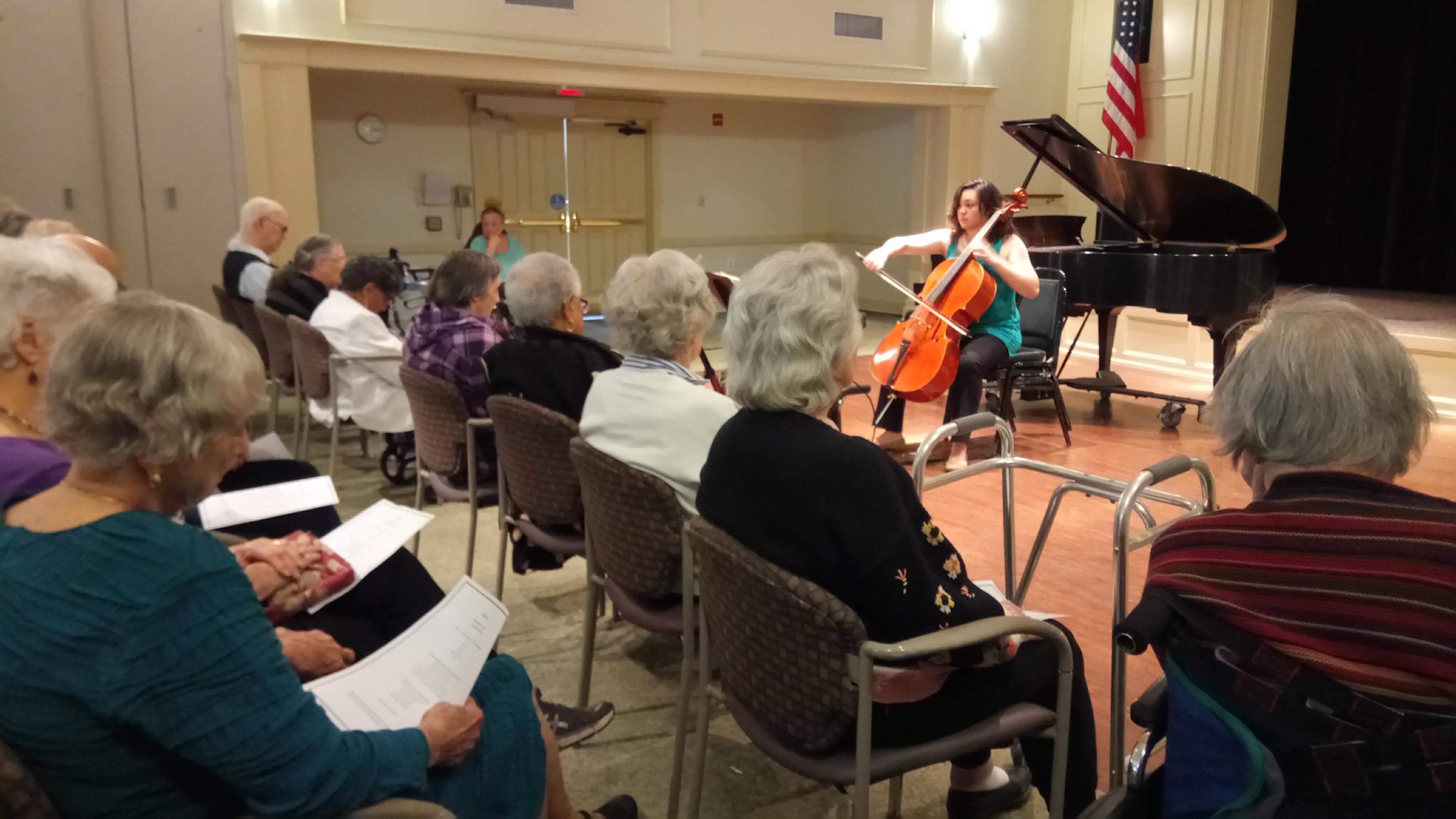 Samantha Flores, 28, gave a cello recital on March 20 as part of a program that connects young people with residents of a retirement community in Mitchellville, Md. Credit: Ying-Shan Su via the New York Times.