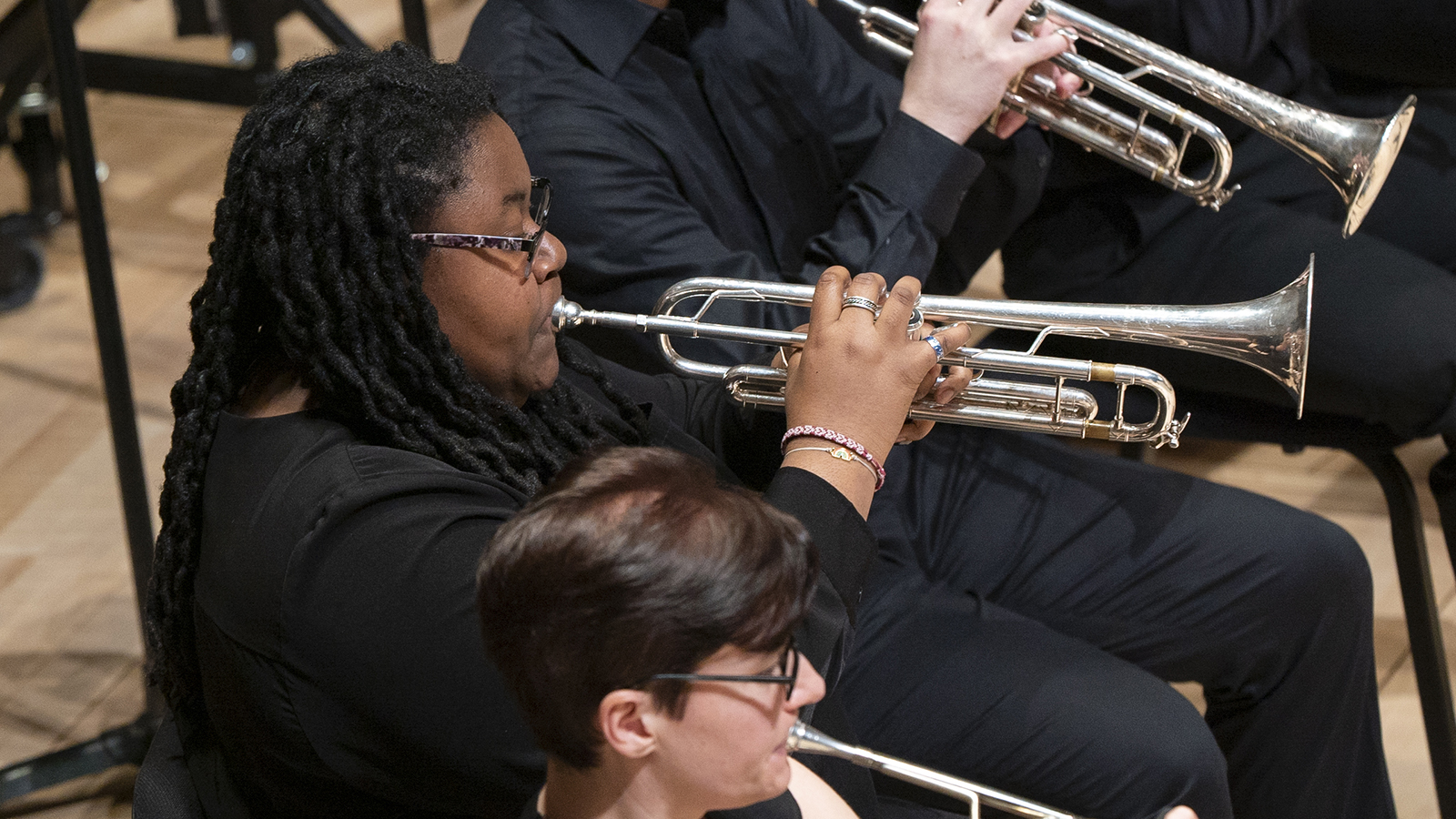 Students play silver-colored trumpets in an UMWO performance.