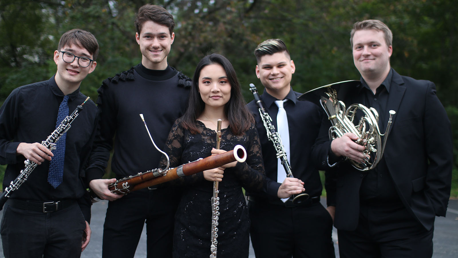 Ignis graduate fellowship woodwind quintet, from left to right: Nathaniel Wolff with an oboe, Christian Whitacre with a bassoon, Danielle Kim with a flute, Kyle Glasgow with a clarinet, and Zachary Miller with a French horn.